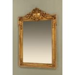 A large gilt painted wood and gesso mirror, with bevelled glass.