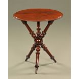 A Victorian mahogany Gypsy table, with oval top and angled turned legs and supports.