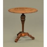 An 18th century oak tripod centre table, of architectural form with carved gadrooned border.