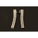 A pair of 18 ct white gold diamond set drop earrings.