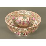 A large Chinese punch bowl, decorated in Canton colours with panelled figures,