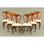 A set of six Victorian mahogany dining chairs, with drop in seats and raised on cabriole front legs.