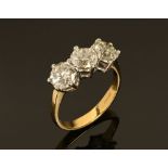 An 18 ct gold two tone three stone diamond ring, set with diamonds weighing +/- 3 carats.