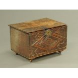 A 17th century oak box, dated 1667 and initialled MI.