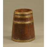 A 19th century brass banded oak coopered log bin. Height 54 cm, diameter at top 33 cm.