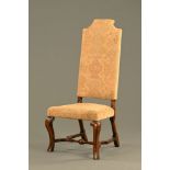 A late 17th century walnut upholstered side chair with baluster knopped stretcher.