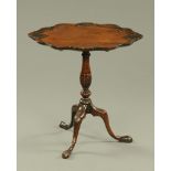 An early 20th century mahogany Chippendale style oval tripod table, with fixed top,