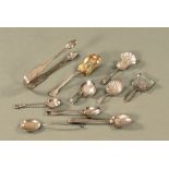 Four silver caddy spoons, together with a pair of sugar tongs and five further miscellaneous spoons,