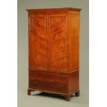 An Edwardian inlaid mahogany George III style wardrobe on chest,