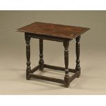 A 17th century oak side table,