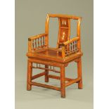 A late 19th century Chinese hardwood armchair, the back inlaid with bone and with solid seat.