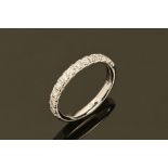 An 18 ct gold diamond set half eternity ring, diamond weight +/- .38 carats.
