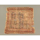 An antique Persian rug, with fringed ends (AF). 150 cm x 138 cm.