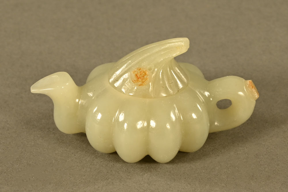 A Chinese green jade teapot. Length 7.5 cm.