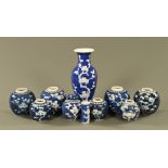 A collection of Chinese prunus vases, including one baluster,