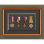 A framed set of Second world War medals, including The Defence Medal and two Stars, unnamed.