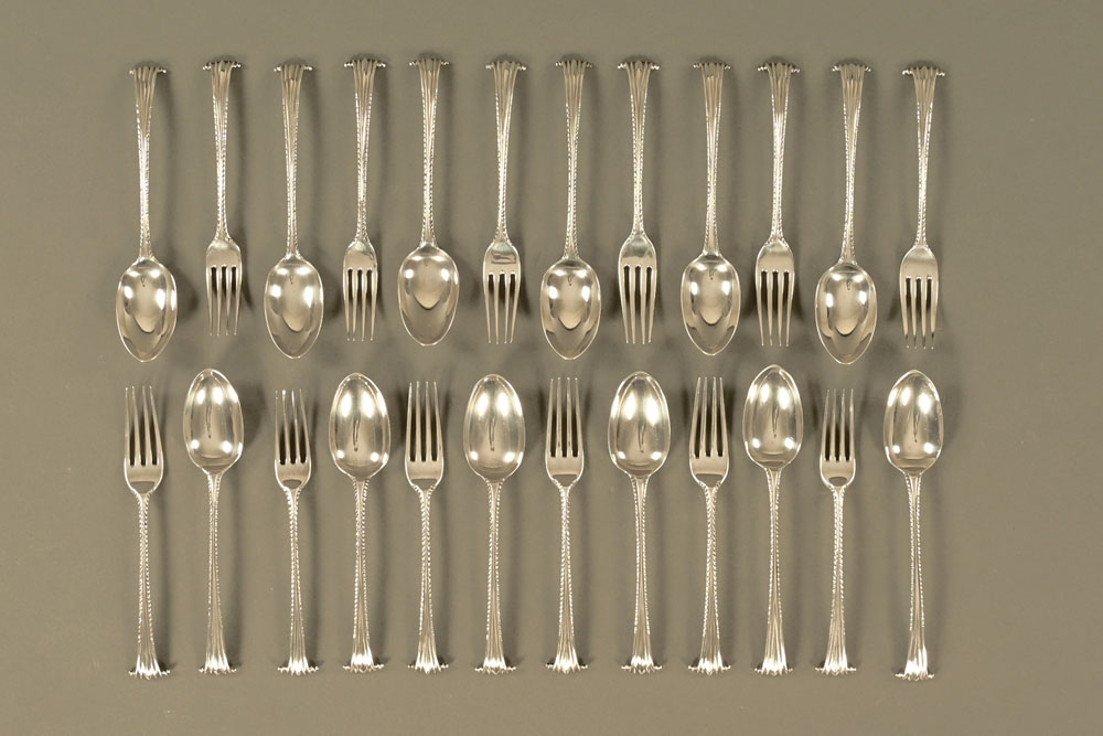 Twelve pairs of Onslow pattern principally George III forks and spoons, various makers and marks,