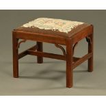 A George III mahogany stool,