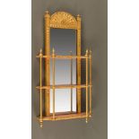 An Edwardian gilt framed mirror and combined three tier shelf unit. Height 86 cm, width 43 cm.