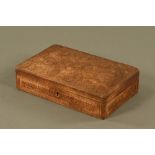 A Burmese carved teak box, decorated with repeating foliate designs and with fitted interior.