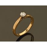 An 18 ct gold solitaire diamond ring, round brilliant cut, .