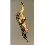 A large Majolica climbing monkey figure. Height 68 cm.