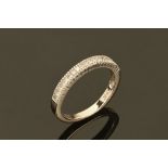 A 14 ct gold diamond set half eternity ring.