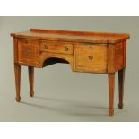 A George III mahogany sideboard, with shallow rear upstand and rosewood banded edge,