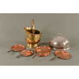 A brass coal helmet, together with a meat cover and Victorian pan lids.