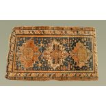 An Eastern fringed rug,