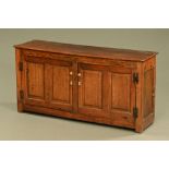 An 18th century oak low cupboard,