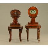 Two Georgian mahogany hall chairs, one with painted crest, the similar chair with reeded sabre legs.