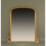 A large Victorian giltwood and gesso overmantle mirror, with moulded and beaded edge.