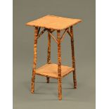 An Edwardian bamboo two tier occasional table. Height 66 cm, top 36 cm square.