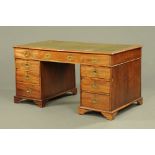 A Victorian mahogany military pedestal partners desk.