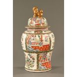 A Chinese vase, of large form, lidded and decorated in Canton colours. Height 62 cm.