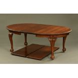 An early 20th century mahogany dining table,