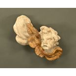 A large 17th century carved and parcel giltwood and painted Baroque cherub, possibly English.