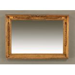 A Victorian gilt framed mirror, rectangular with applied bellflower ornament. 59 cm x 82 cm.