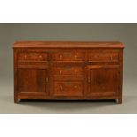 An antique oak reproduction dresser base,
