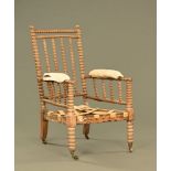 A 19th century bobbin turned armchair, in country house condition.