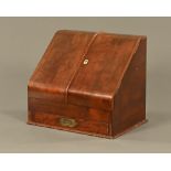 A Victorian mahogany slope front stationery cabinet, with fitted interior and drawer.