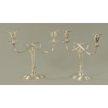 A pair of silver plated two branch candelabra, with detachable moulded sconces.