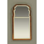 A 19th century walnut framed Queen Anne style mirror, with bevelled glass.