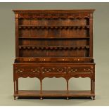 An 18th century oak dresser with Delft rack,