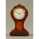 An Edwardian inlaid mahogany mantle clock, with single train movement,