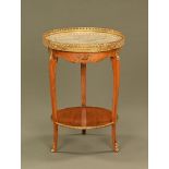 A continental style marble topped circular two tier side table,