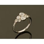 A white gold coloured metal diamond set cluster ring, hallmark rubbed. Size M/N, 3.1 grams.