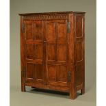 A part 18th century and later oak wardrobe,