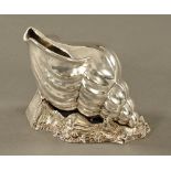 An Atkin Brothers silver plated conch shell spoon warmer. Length 17 cm.